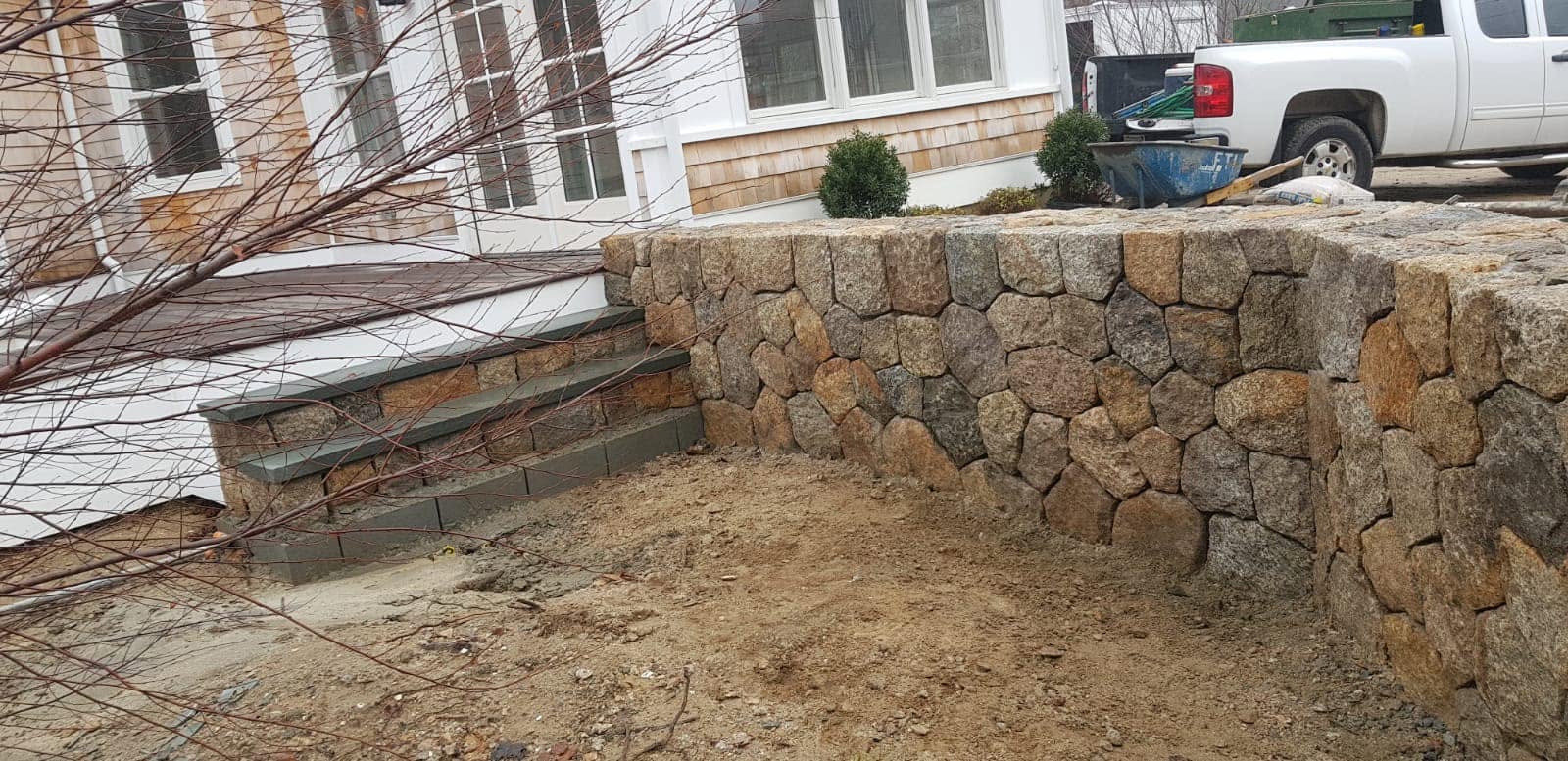 Finished granite stone wall and steps built by New England Star