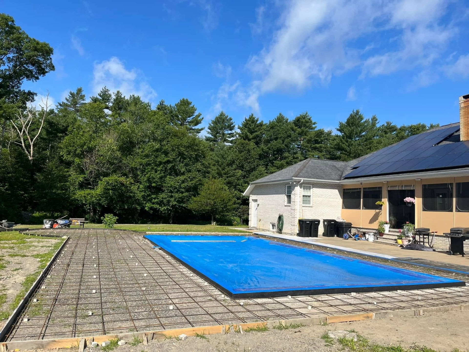 Concrete pool forms being installed on a residential project in Fall River MA